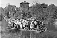 Raft carrying visitors to Tom Sawyer Island at Disneyland, about 1960