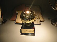 Football-shaped trophy, mounted on a base