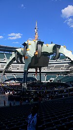 It's still daytime, and the spire stands out against a clear blue sky. The stage is empty and audience members are just starting to arrive at Lincoln Financial Field in Philadelphia.