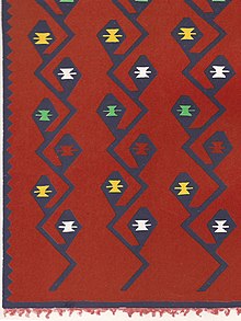 A shaggy carpet with hook designs from Korçë