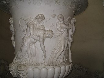 Satyr holding a thyrsus, supporting a drunken ivy-wreathed silenus, from the Borghese Vase, 1st century BC (Louvre)