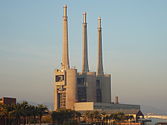 The three chimneys of the nowadays closed Besòs power termal station have become an icon for the city. In 2008, the citizens of Sant Adrià decided to keep them in a referendum.[15]