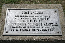 Metal plaque which reads: Time capsule interred November 1965 by the city of Hampton in honor of Christopher Columbus Kraft Jr. pioneer of U.S. space program to be opened November 2065
