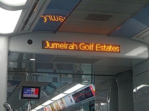 Jumeirah Golf Estates sign on a metro train