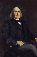 Coloured portrait of a man with long white hair balding in the middle in jacket facing forward.