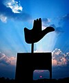 Open Hand Monument in silhouette
