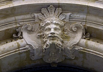 Baroque mascaron with a palmette above it, on the façade of the Hôtel d'Aubray (Rue Charles-V no. 12), Paris, unknown architect, 17th century
