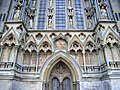 The 13th century west front was vandalised during the Monmouth Rebellion, destroying many figures of the west front and leaving others, like those of the Coronation of the Virgin, headless.