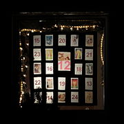 An Advent calendar consisting of images that have dates on the inverse side