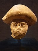 An official wearing the "mushroom-headed" hairstyle also seen in contemporary paintings of Western Asiatic foreigners such as in the tomb of Khnumhotep II, at Beni Hasan. Excavated in Avaris, the Hyksos capital. Staatliche Sammlung für Ägyptische Kunst.[40][41][42][43]