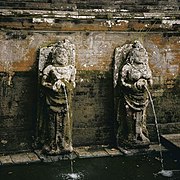 Fountain waterspout statues in Goa Gajah sacred bathing pool.