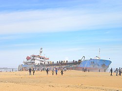 A dredger ship washed up on the Mundakkal beach
