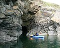 Kayaking in caves at the mouth of Solva Harbour