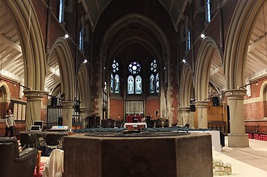 Facing east in the nave; the font in the foreground