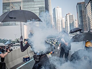 Police shooting tear gas canister to protesters