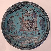 Polychrome bowl with a Majlis scene by a pond, signed by Abu Zayd al-Kashani. Dated 1187.[5]