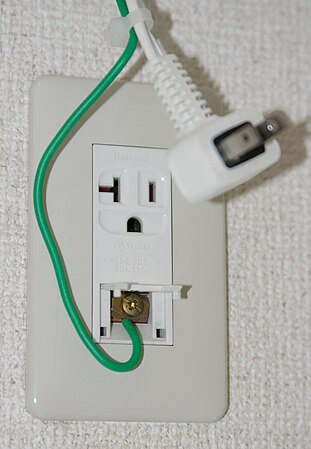Japanese 20 A socket with earth post and earth connector, for an air conditioner (similar to NEMA 5-20)