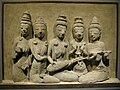 Hindu. 650-700 C.E., Thailand, Ku Bua, (Dvaravati culture). Three musicians in right are playing (from center) a 5-stringed lute, cymbals, a tube zither or bar zither with gourd resonator.