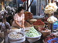 Market stall keeper wearing thanaka, Mandalay