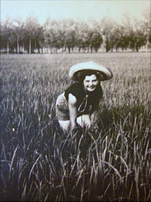 Photograph of a mondina woman working in a field