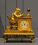 Mantel clock called The Reader; by Jean-Andre Reiche; circa 1810; matte and polished gilt bronze and "Vert de Mer" marble; 31 x 15 x 26 cm; Montreal Museum of Fine Arts (Montreal, Canada)[19]
