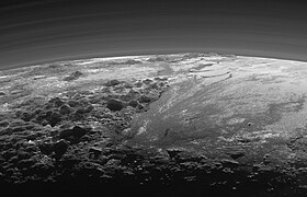 New Horizons view of Pluto's Tenzing Montes in the left foreground (also in preceding image) and Hillary Montes on the horizon