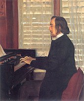 man in top hat, smoking a cigarette, seated at a musical keyboard