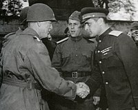 US Army General Courtney Hodges (left) greets Soviet Army Major General Gleb Baklanov (right) after the meeting of Soviet and US forces on the Elbe