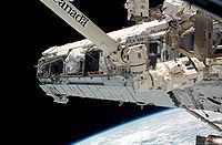 ISS S1 truss element being installed on STS-112 October 10, 2002