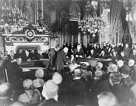 Canadian Secretary of State for External Affairs Mackenzie King signing