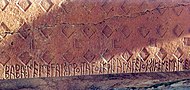 6th century BCE inscription with the Phrygian alphabet from the Midas Tomb, Midas City: ΒΑΒΑ: ΜΕΜΕϜΑΙΣ: ΠΡΟΙΤΑϜΟΣ: ΚΦΙJΑΝΑϜΕJΟΣ: ΣΙΚΕΝΕΜΑΝ: ΕΔΑΕΣ (Baba, memevais, proitavos kziyanaveyos sikeneman edaes; Baba, advisor, leader from Tyana, dedicated this niche).[36][37]