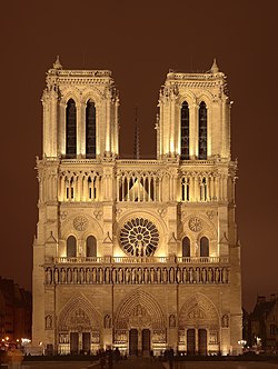 The cathedral illuminated at night.