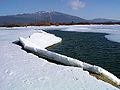 Lake Cerknica in winter, with the summit of Mount Slivnica in the background