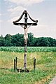 A Latin crucifix with a stylized INRI plaque attached, in cornfields near Mureck, Styria, Austria