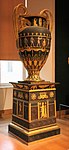 Egyptian Revival vase with pedestal; 1804-1806; varnished sheet and gilded bronze; height: 1.80 m, depth: 0.95 m; Louvre[17]
