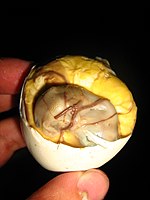 Underaged balut with visible chick