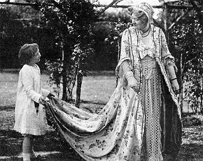 In her garden with granddaughter Nelly Gordon, c. 1918.
