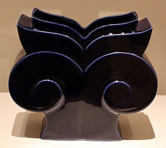Postmodern vase inspired by the Ionic capital, deisgned by Michael Graves for Swid Powell, 1989, glazed porcelain, Indianapolis Museum of Art, Indianapolis, US[34]