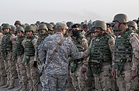 Iraqi army soldiers finish training assisted by American advisers during the Iraq War.