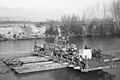 A Sherman tank and a Jeep ferried across the river Garigliano, central Italy, using a raft constructed from pontoons and a section of Bailey bridge (January 1944)