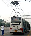 Image 154On this articulated Beijing trolleybus, the operator uses ropes to guide the trolley poles to contact the overhead wires. (from Trolleybus)