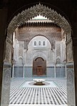 A lambrequin arch with muqarnas in the Madrasa al-Attarine, Fes