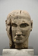 Etruscan pear wood head, 7th century BC