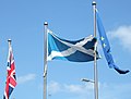 The Flag of the United Kingdom, Flag of Scotland and Flag of Europe at the Scottish Parliament Building.