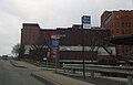 This picture was taken the day the hospital was renamed from "Mercy Hospital of Pittsburgh" to "UPMC Mercy". The hospital helipad is visible to the right, and the entrance to Duquesne University is visible to the far left. The MacLachlan Wing, an 8 floor high-rise is on the right.
