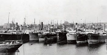 Ships moored, ready to load coal (1910)