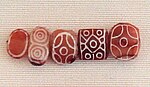 Indian etched carnelian beads, imported to Susa in 2600-1700 BCE. Found in the tell of the Susa acropolis. Louvre Museum.[20][21][22] Identical with beads found in Dholavira.[23]