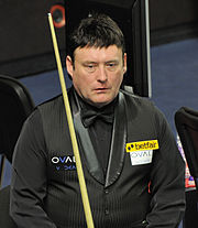 Jimmy White holding a snooker cue