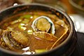 Obunjagi ttukbaegi,a stew made with variously colored abalone (Haliotis diversicolor) in a ttukbaegi pot