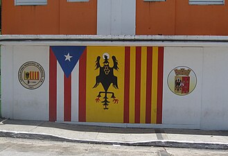 Symbols painted on wall in downtown Morovis